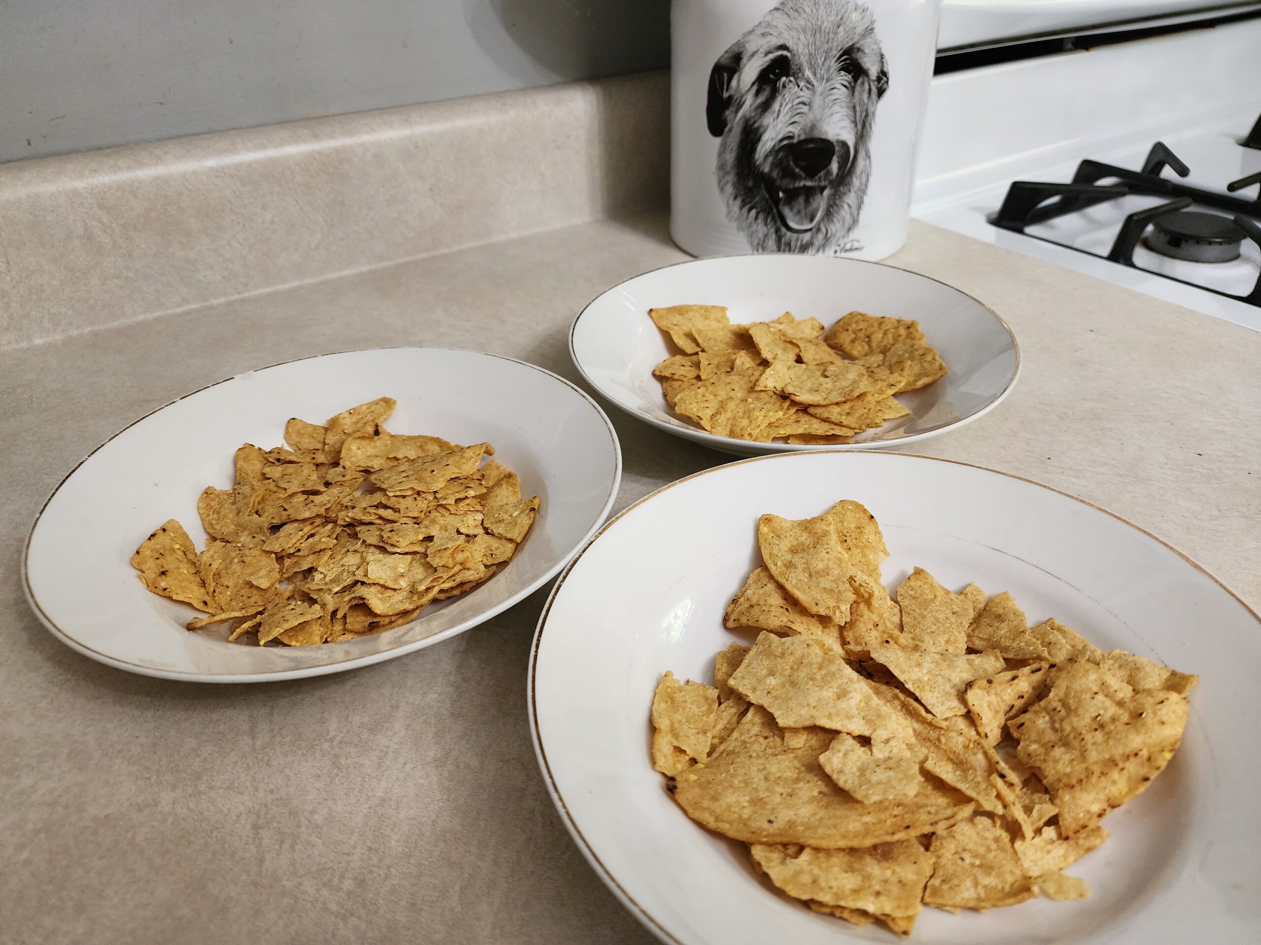 Three bowls of crunchy tortilla chips