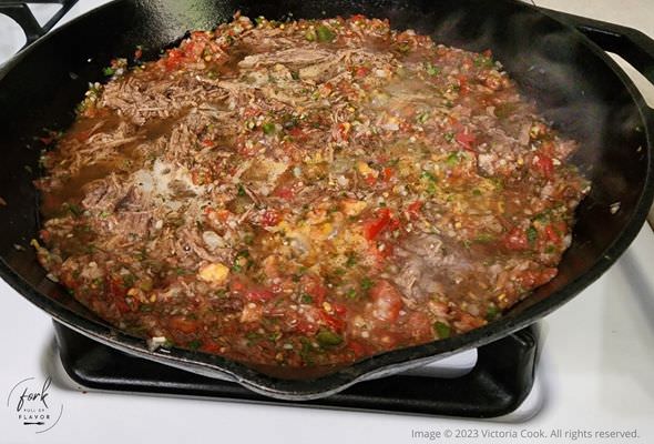 Chilaquiles & Eggs - meat and salsa mixture