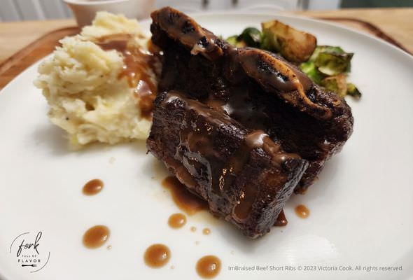 Braised Beef Short Ribs with gravy, garlic mashed potatoes and roasted brussel sprouts