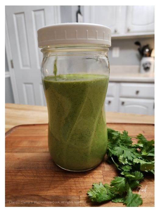 A jar of cilantro crema