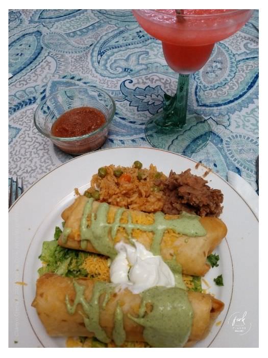 Plated Chimichanga with Cilantro Crema on top