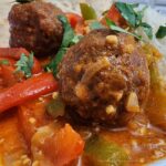 Thai Turkey Meatballs with bell peppers, onions in a coconut curry garnished with cilantro