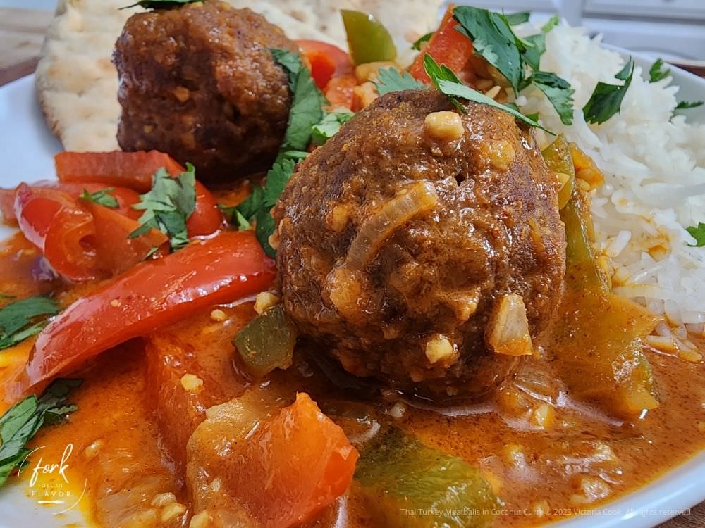 Thai Turkey Meatballs with bell peppers, onions in a coconut curry garnished with cilantro
