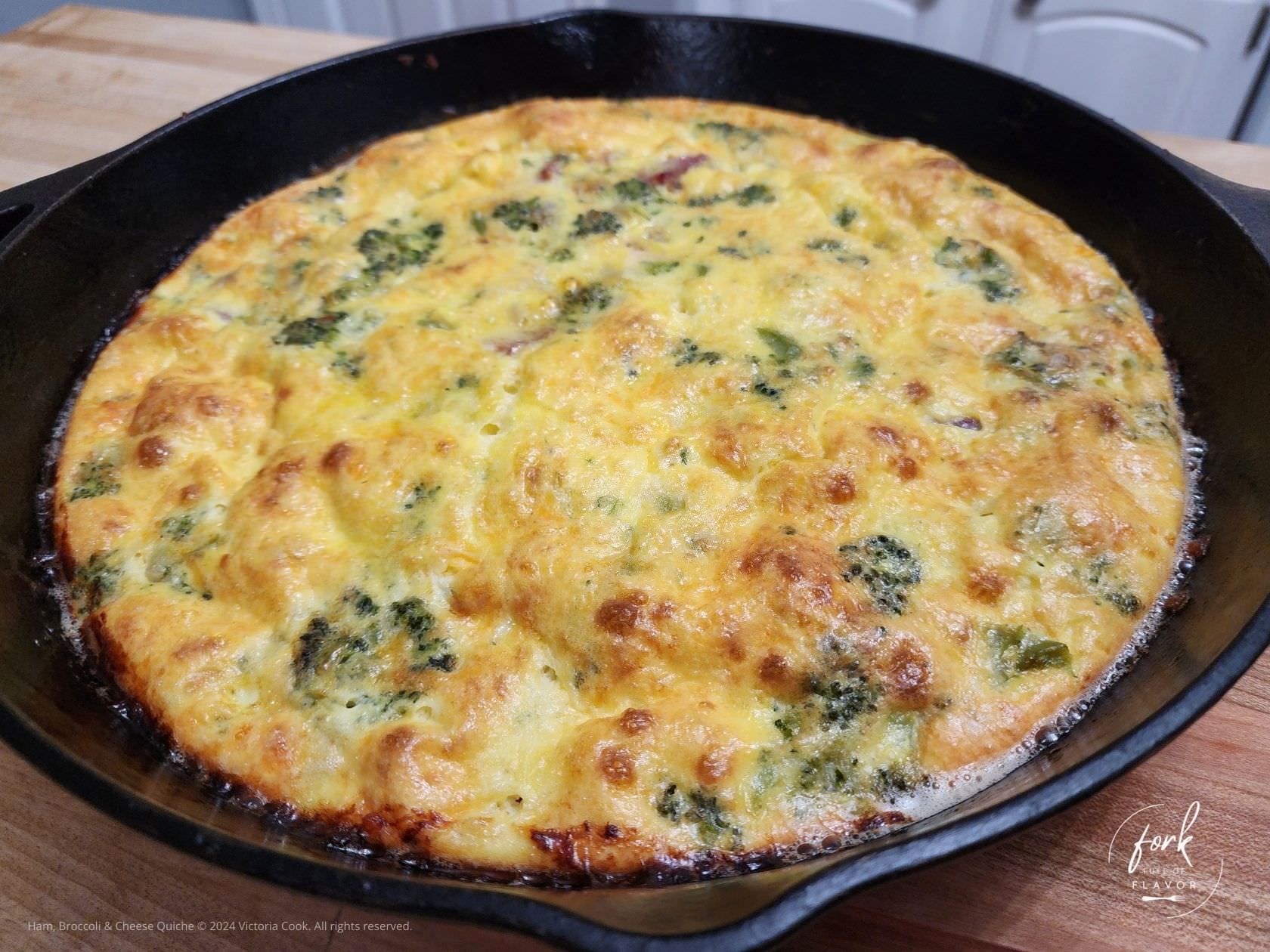 Broccoli, Ham and Cheese Quiche cooked in a cast iron pan