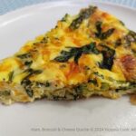 Broccoli, Ham and Cheese Quiche ready to eat on a plate