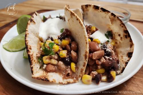Taco Soup Tacos Leftover taco soup in tortillas topped with cilantro and sour cream.